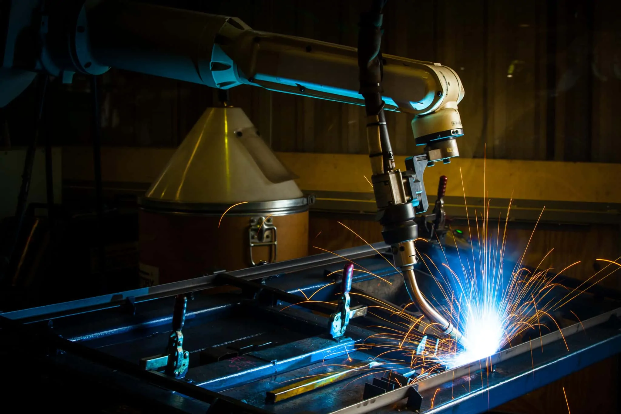 Robotic arm welding.